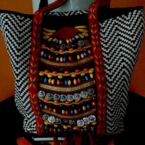 Bohemian style shoulder bag with straps.